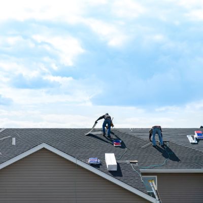 4 construction workers fixing roof against clouds blue sky, inst